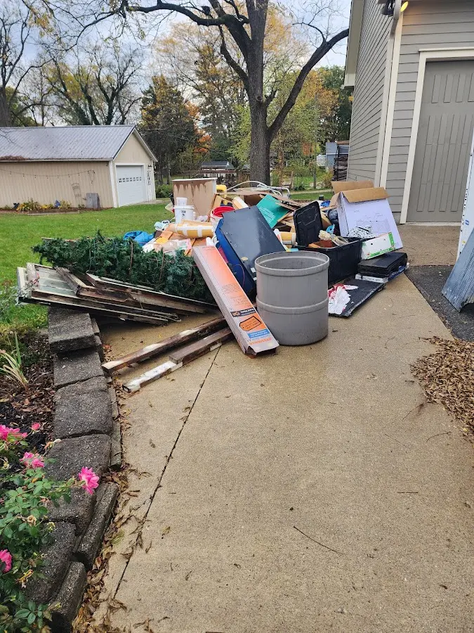 Dumpster being loaded with debris for 30 Yard Dumpster Rental in Elk Grove